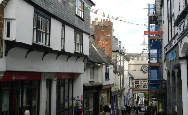 A pedestrian street with colourful bunting above